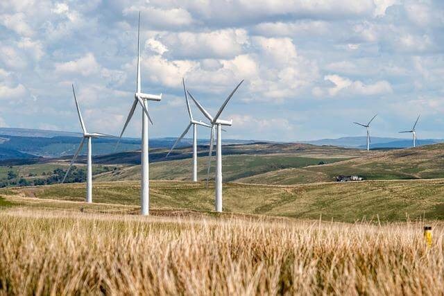 Group of wind turbines in a field for clean energy