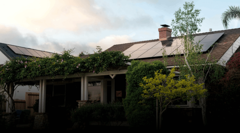 Residential home with rooftop solar panels.